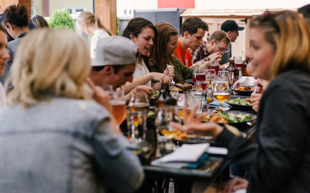 People enjoying wine and food